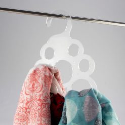 Clear acrylic scarf hanger with product
