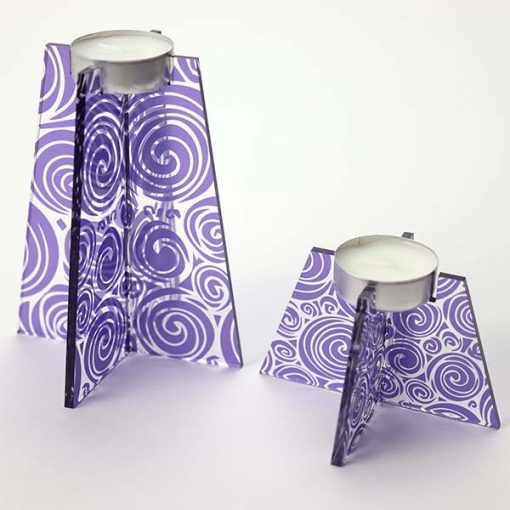 Group Of Purple Swirl Tea Light Holders With Candle